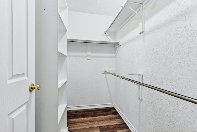 2107 Meadows Cir, Sherman, TX 75092 - walk in closet featuring dark wood finished floors