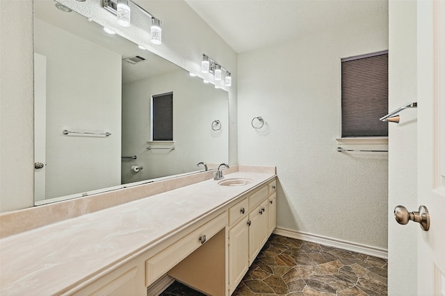 2107 Meadows Cir, Sherman, TX 75092 - bathroom with vanity and baseboards