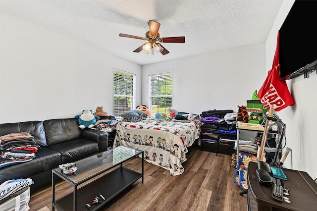 2107 Meadows Cir, Sherman, TX 75092 - bedroom featuring wood finished floors, a textured ceiling, and a ceiling fan