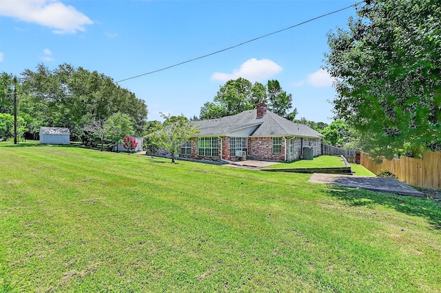 2107 Meadows Cir, Sherman, TX 75092 - view of yard featuring a storage shed