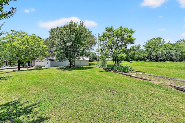 2107 Meadows Cir, Sherman, TX 75092 - view of grassy yard featuring an outdoor structure