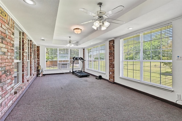 2107 Meadows Cir, Sherman, TX 75092 - workout area with brick wall, carpet floors, a ceiling fan, a tray ceiling, and cooling unit