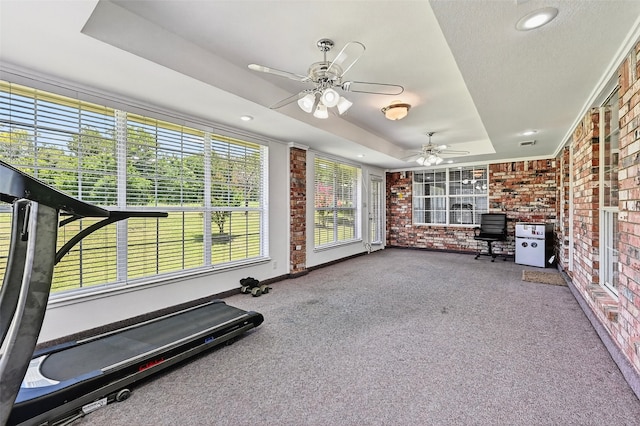 2107 Meadows Cir, Sherman, TX 75092 - exercise room featuring a raised ceiling, carpet floors, brick wall, recessed lighting, and ceiling fan