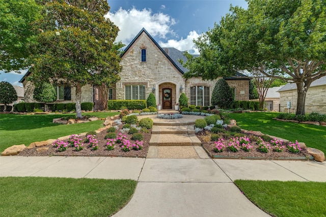 2521 Fair Oaks Ln, Prosper, TX 75078 - french country style house with stone siding and a front yard