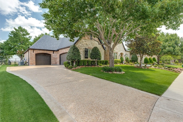 2521 Fair Oaks Ln, Prosper, TX 75078 - view of front of home featuring a garage, a front yard, concrete driveway, a shingled roof, and brick siding
