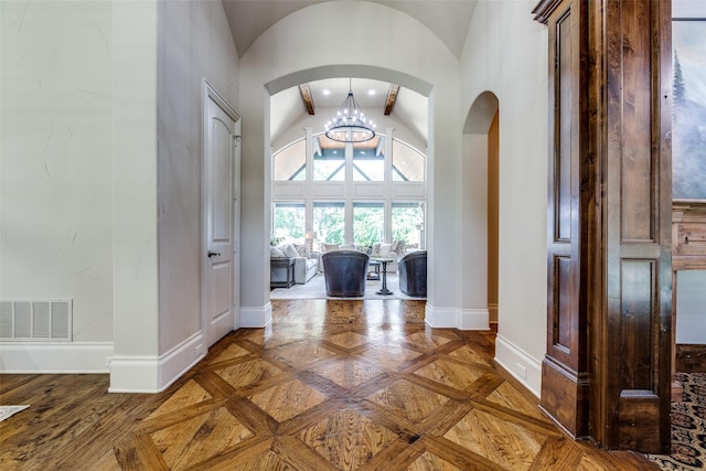 2521 Fair Oaks Ln, Prosper, TX 75078 - entryway featuring lofted ceiling, arched walkways, and a chandelier