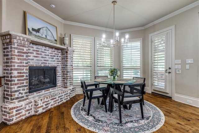 2521 Fair Oaks Ln, Prosper, TX 75078 - dining space with a chandelier, wood finished floors, crown molding, and a brick fireplace