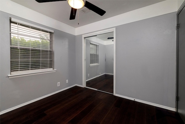740 Willow St, Hurst, TX 76053 - unfurnished bedroom featuring wood finished floors, a closet, and a ceiling fan
