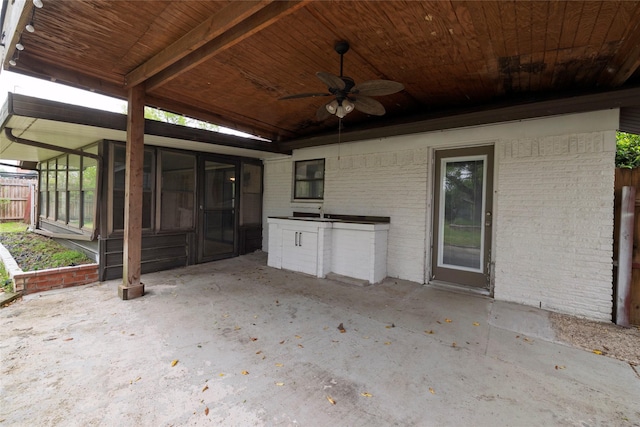 740 Willow St, Hurst, TX 76053 - view of patio featuring a ceiling fan, a sunroom, and exterior kitchen