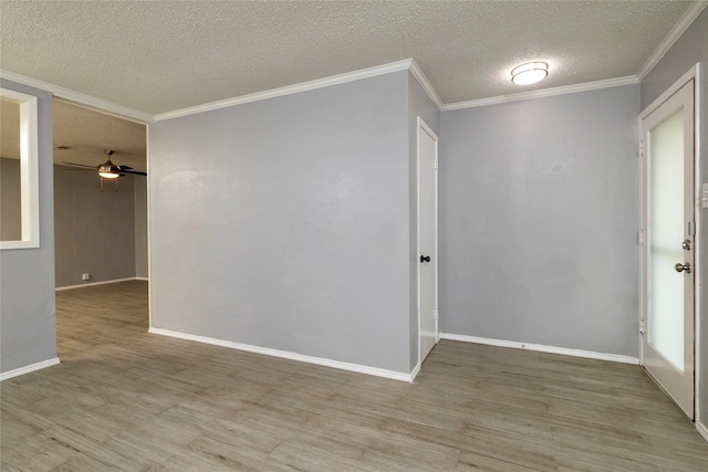 740 Willow St, Hurst, TX 76053 - spare room featuring light wood finished floors, a textured ceiling, ceiling fan, and crown molding