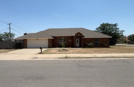 307 W Dormard Ave, Midland, TX 79705 - ranch-style home featuring driveway and an attached garage
