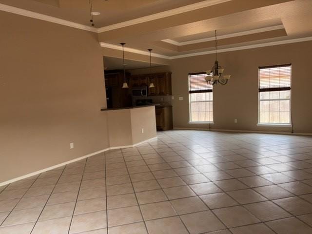 307 W Dormard Ave, Midland, TX 79705 - unfurnished living room with a raised ceiling, a chandelier, light tile patterned floors, and crown molding