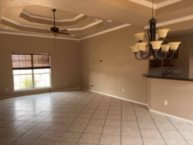 307 W Dormard Ave, Midland, TX 79705 - spare room with a raised ceiling, ornamental molding, a ceiling fan, tile patterned flooring, and a chandelier
