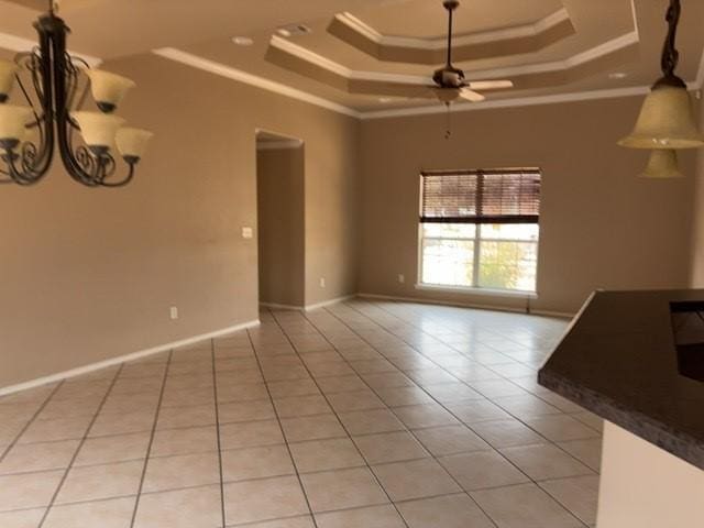 307 W Dormard Ave, Midland, TX 79705 - empty room with a raised ceiling, crown molding, light tile patterned flooring, ceiling fan, and a chandelier