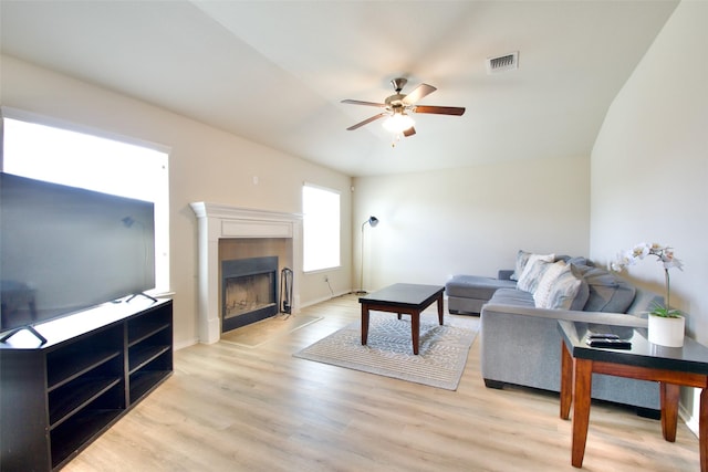 9929 Caney Creek Dr, Waco, TX 76708 - living area with ceiling fan, light wood-type flooring, and a tile fireplace