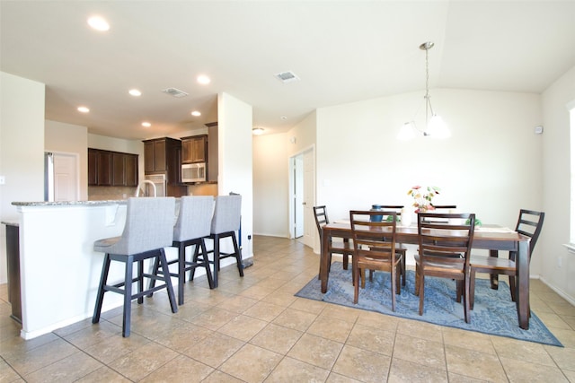 9929 Caney Creek Dr, Waco, TX 76708 - dining space with recessed lighting, light tile patterned floors, and vaulted ceiling