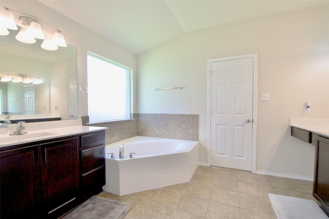 9929 Caney Creek Dr, Waco, TX 76708 - bathroom with vanity, a garden tub, lofted ceiling, and tile patterned floors