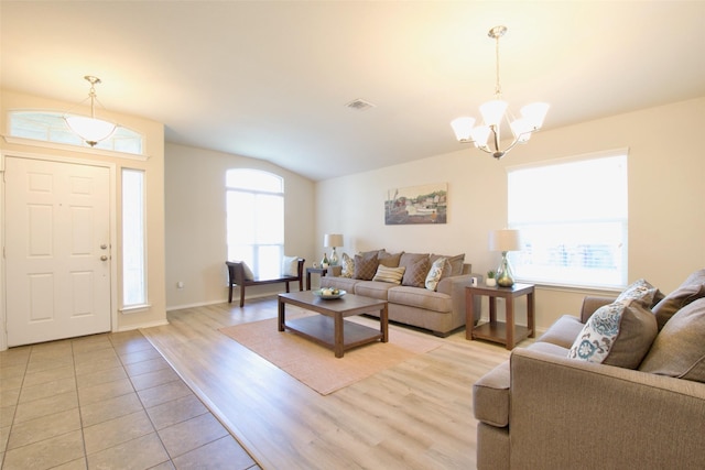 9929 Caney Creek Dr, Waco, TX 76708 - living area with a chandelier, plenty of natural light, vaulted ceiling, and light wood finished floors