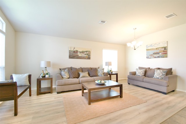 9929 Caney Creek Dr, Waco, TX 76708 - living area featuring a chandelier and light wood-style floors