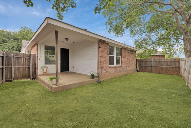 8805 Highland Orchard Dr, Fort Worth, TX 76179 - rear view of property featuring brick siding, a patio, and a fenced backyard