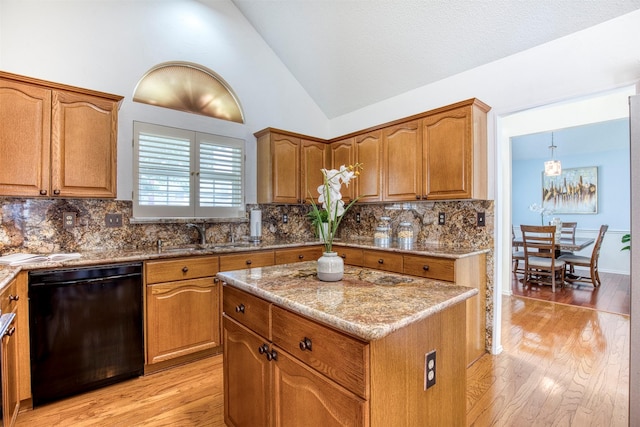3104 Park Garden Pl, Richardson, TX 75082 - kitchen featuring black dishwasher, light wood-type flooring, decorative backsplash, light stone counters, and high vaulted ceiling