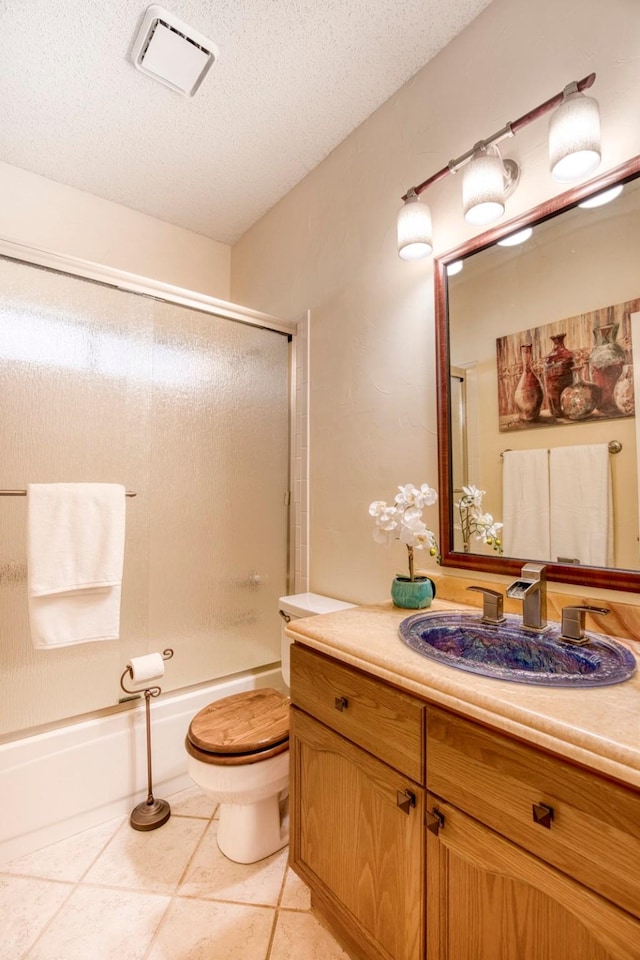 3104 Park Garden Pl, Richardson, TX 75082 - full bathroom with vanity, shower / bath combination with glass door, a textured ceiling, and tile patterned floors