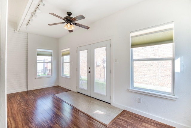 3104 Park Garden Pl, Richardson, TX 75082 - entryway with rail lighting, wood finished floors, french doors, and a ceiling fan