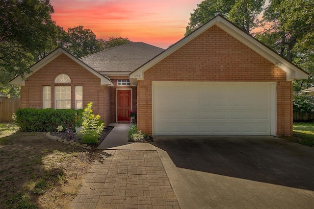 692 High Crest Dr, Azle, TX 76020 - view of front of home featuring brick siding, concrete driveway, and an attached garage