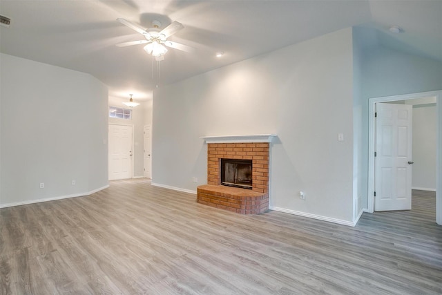 692 High Crest Dr, Azle, TX 76020 - unfurnished living room featuring ceiling fan, light wood-style floors, a brick fireplace, and lofted ceiling