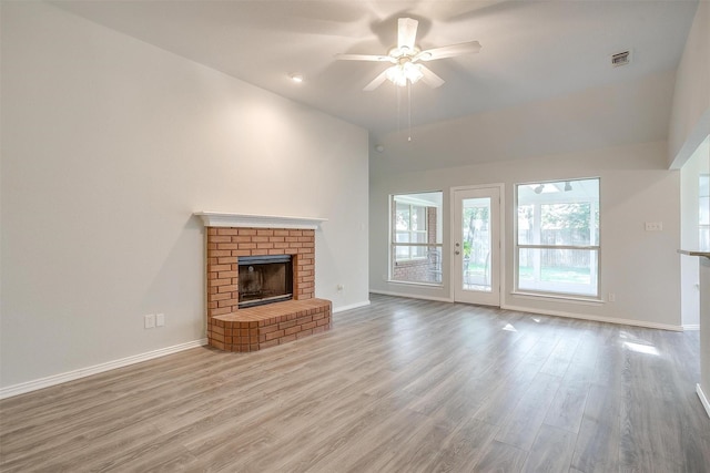 692 High Crest Dr, Azle, TX 76020 - unfurnished living room featuring ceiling fan, high vaulted ceiling, wood finished floors, and a fireplace