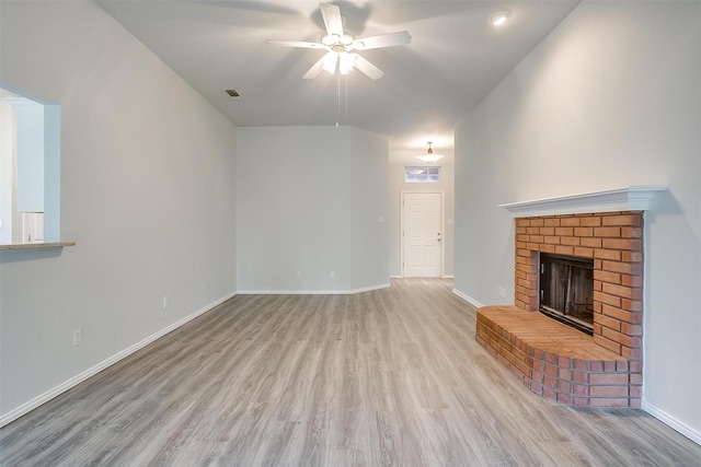 692 High Crest Dr, Azle, TX 76020 - unfurnished living room with ceiling fan, wood finished floors, and a fireplace