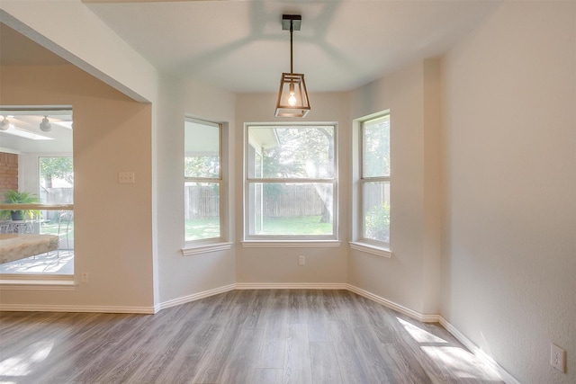 692 High Crest Dr, Azle, TX 76020 - unfurnished dining area with wood finished floors and baseboards