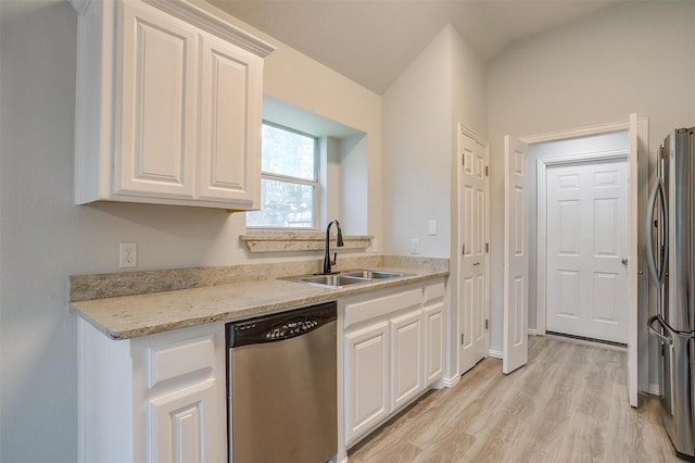 692 High Crest Dr, Azle, TX 76020 - kitchen featuring appliances with stainless steel finishes, light wood-type flooring, white cabinetry, and light stone countertops
