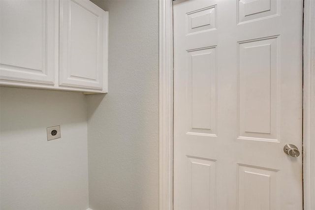 692 High Crest Dr, Azle, TX 76020 - laundry room with electric dryer hookup and cabinet space
