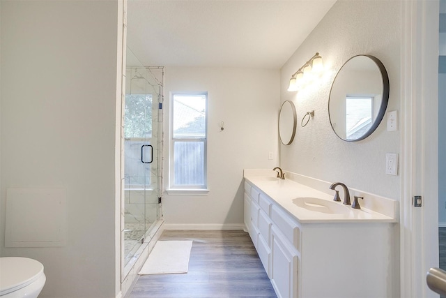 692 High Crest Dr, Azle, TX 76020 - bathroom featuring double vanity, a shower stall, and wood finished floors