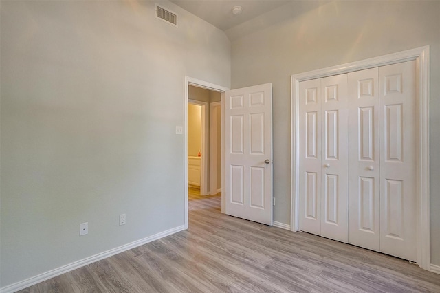 692 High Crest Dr, Azle, TX 76020 - unfurnished bedroom featuring light wood-style flooring and a closet