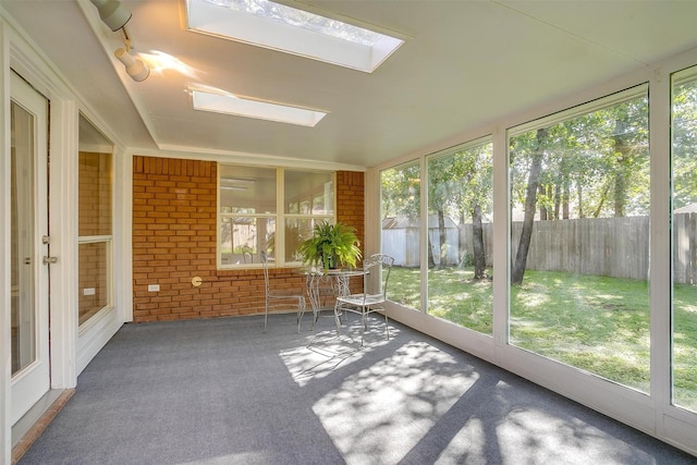 692 High Crest Dr, Azle, TX 76020 - unfurnished sunroom with healthy amount of natural light and a skylight
