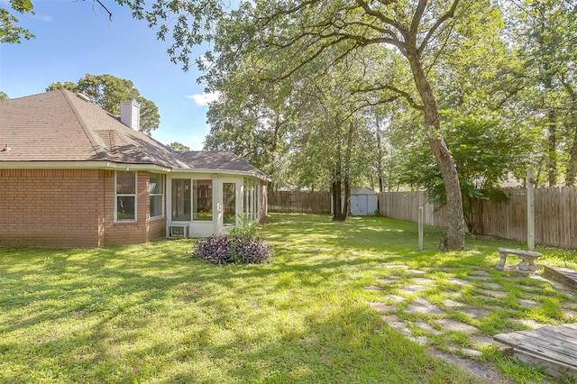 692 High Crest Dr, Azle, TX 76020 - fenced backyard featuring a sunroom and a storage unit