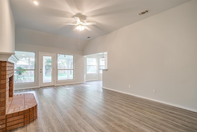 692 High Crest Dr, Azle, TX 76020 - unfurnished living room with ceiling fan, a fireplace, wood finished floors, and lofted ceiling