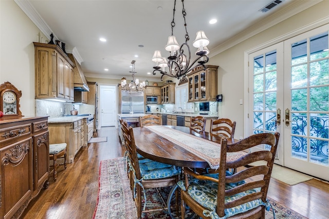 5930 Desco Dr, Dallas, TX 75225 - dining room featuring a chandelier, crown molding, dark wood-style flooring, recessed lighting, and french doors