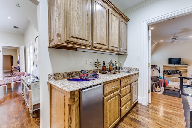 5930 Desco Dr, Dallas, TX 75225 - bar featuring crown molding, arched walkways, wood finished floors, refrigerator, and ceiling fan