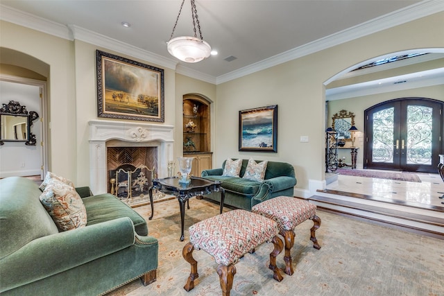 5930 Desco Dr, Dallas, TX 75225 - living room with french doors, arched walkways, ornamental molding, built in shelves, and a premium fireplace