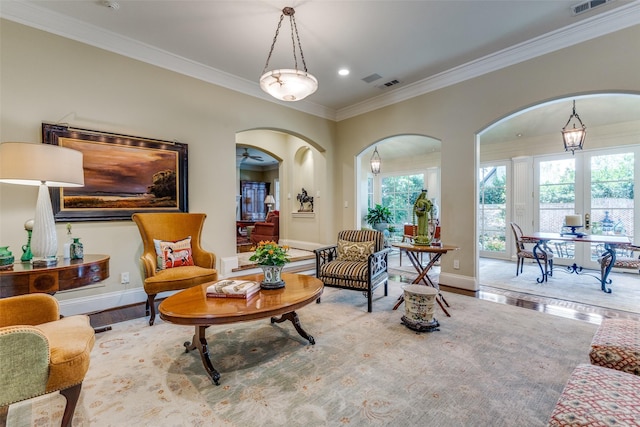 5930 Desco Dr, Dallas, TX 75225 - living area featuring crown molding, plenty of natural light, arched walkways, wood finished floors, and recessed lighting