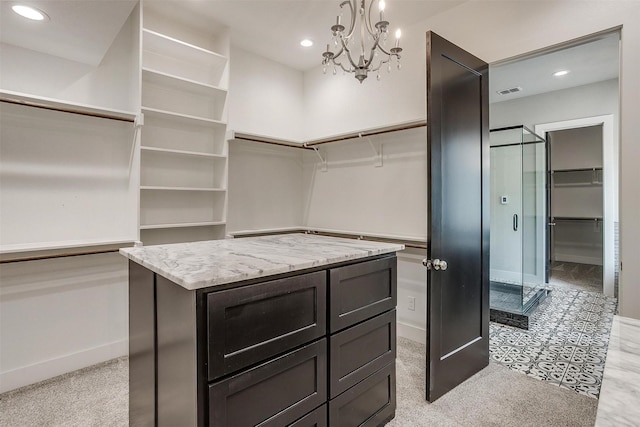 521 Echo Glade Ct, Azle, TX 76020 - walk in closet featuring a chandelier and light carpet