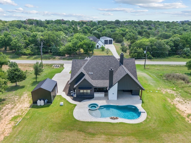 521 Echo Glade Ct, Azle, TX 76020 - view of pool with a yard, an outdoor structure, and a pool with connected hot tub