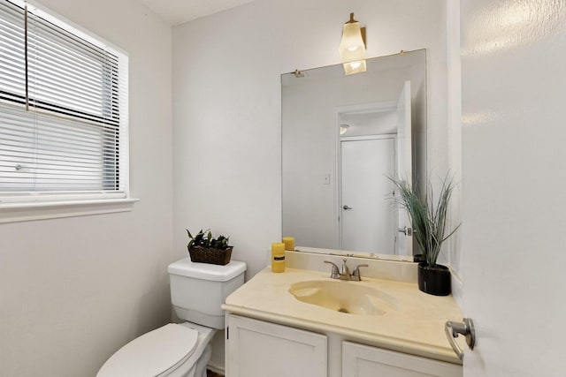 10320 Wood Heights Dr, Dallas, TX 75227 - bathroom with toilet and vanity