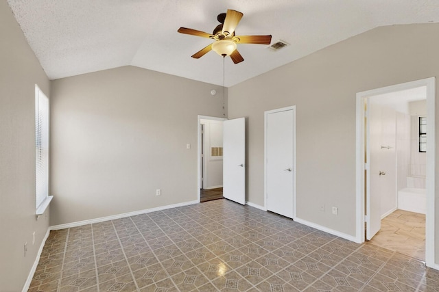 10320 Wood Heights Dr, Dallas, TX 75227 - unfurnished bedroom featuring lofted ceiling and ceiling fan