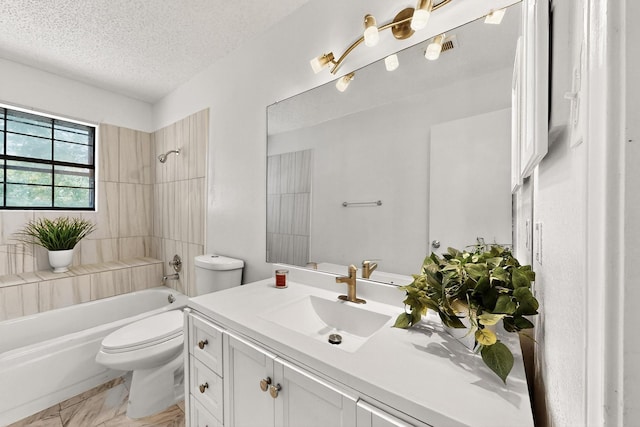 10320 Wood Heights Dr, Dallas, TX 75227 - full bath with vanity, tub / shower combination, a textured ceiling, and marble look tiles