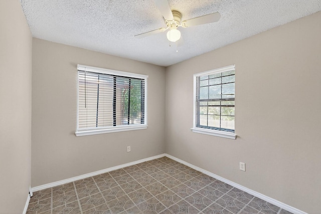 10320 Wood Heights Dr, Dallas, TX 75227 - empty room with a ceiling fan and a textured ceiling