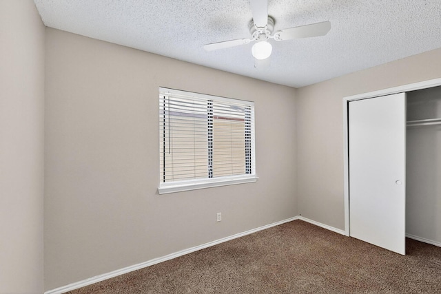 10320 Wood Heights Dr, Dallas, TX 75227 - unfurnished bedroom featuring carpet floors, a textured ceiling, a closet, and a ceiling fan